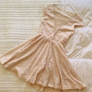 Deep cut dress with modest veiled bodice, swirly-sewn skirt, sweet cap sleeves